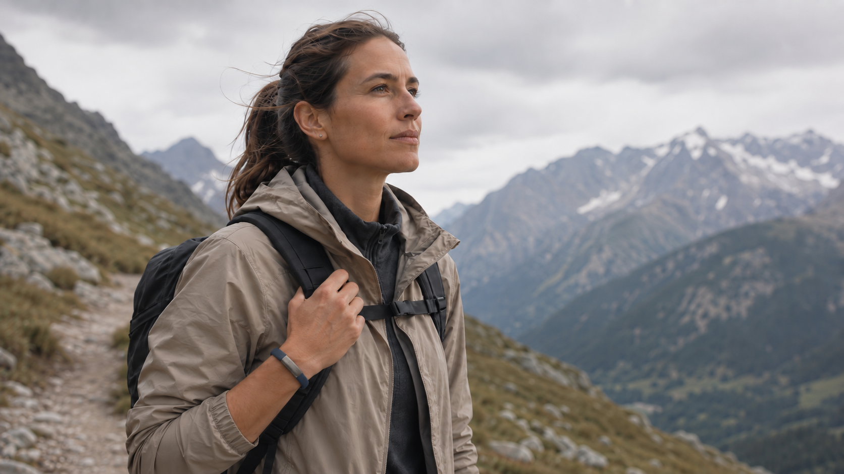 A woman hiking with a Nagome bracelet on her wrist