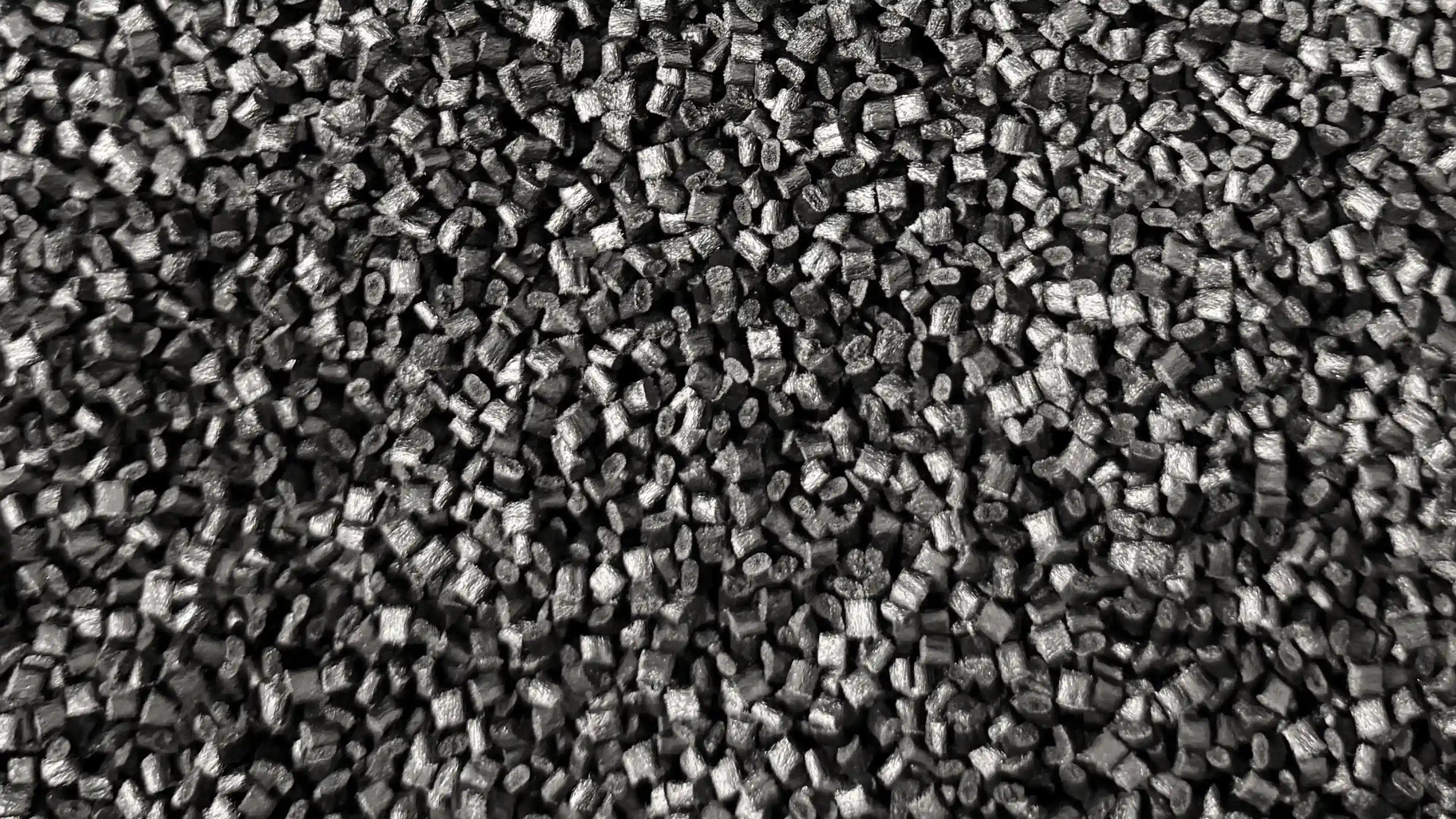 Close-up of black HDPro granulate, the thermoplastic used to 3D print the hulls