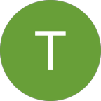 Green circle with a white uppercase letter T in the center.