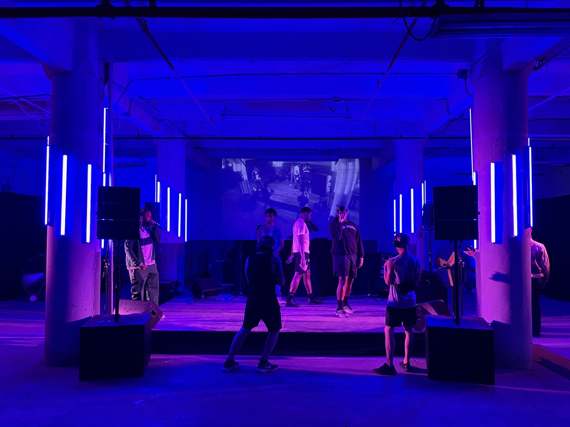 Live performance under blue stage lighting