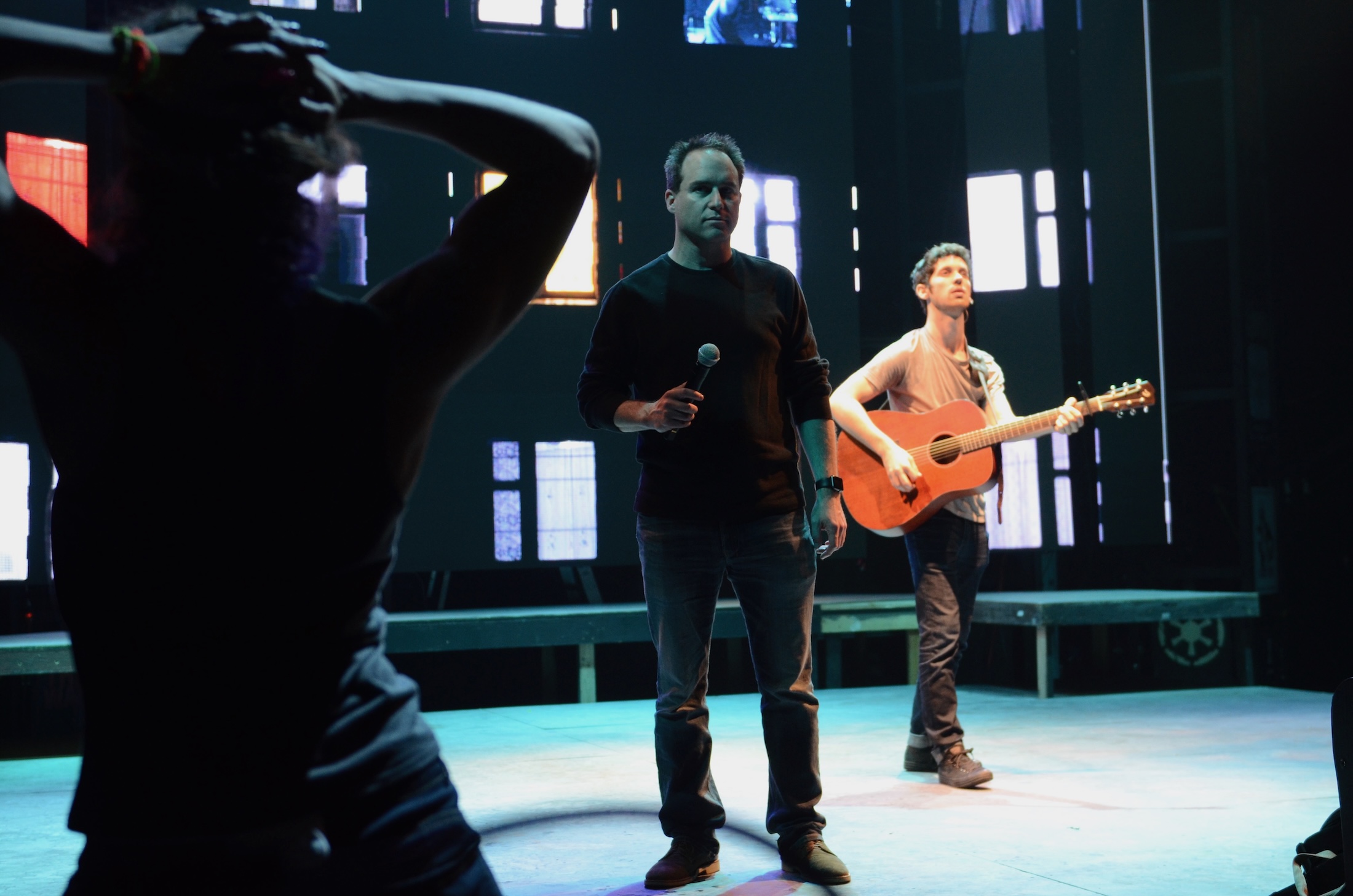 Brian Kite works with performers during a rehearsal for American Idiot.