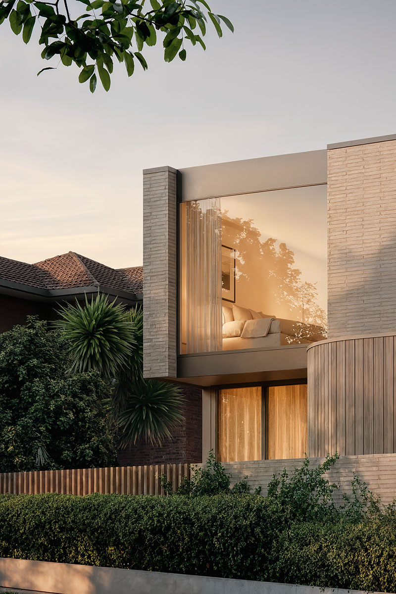 Dusk exterior of brick and timber residence with illuminated bedroom window overlooking St Heliers streetscape