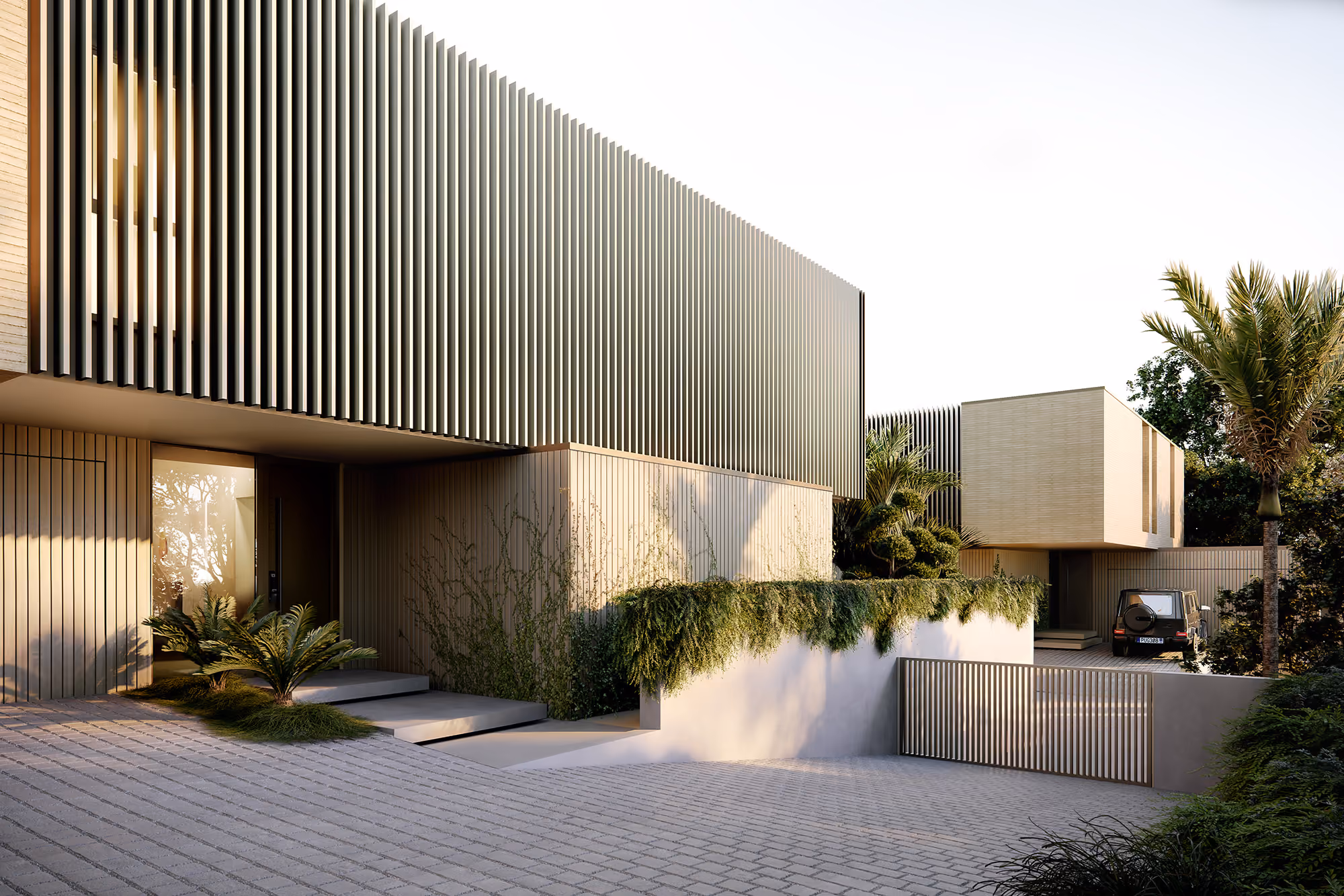 Entrance facade of standalone home with vertical timber cladding, landscaped planting and private driveway gate