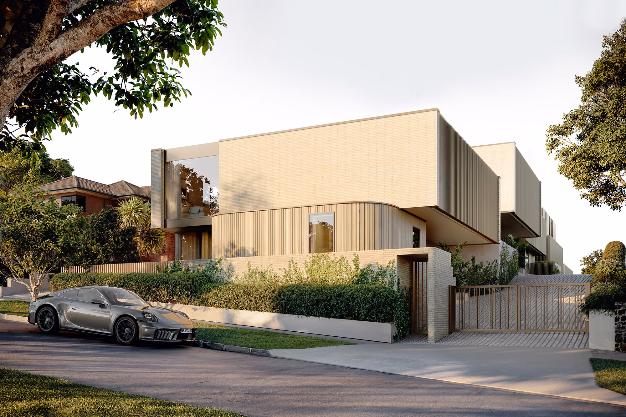 Street view of standalone brick and timber residence at 5 Clarendon Road, St Heliers, with private gated entrance