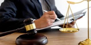 Judge’s gavel beside legal documents