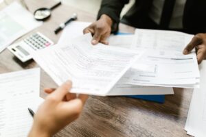 People reviewing tax documents and financial paperwork