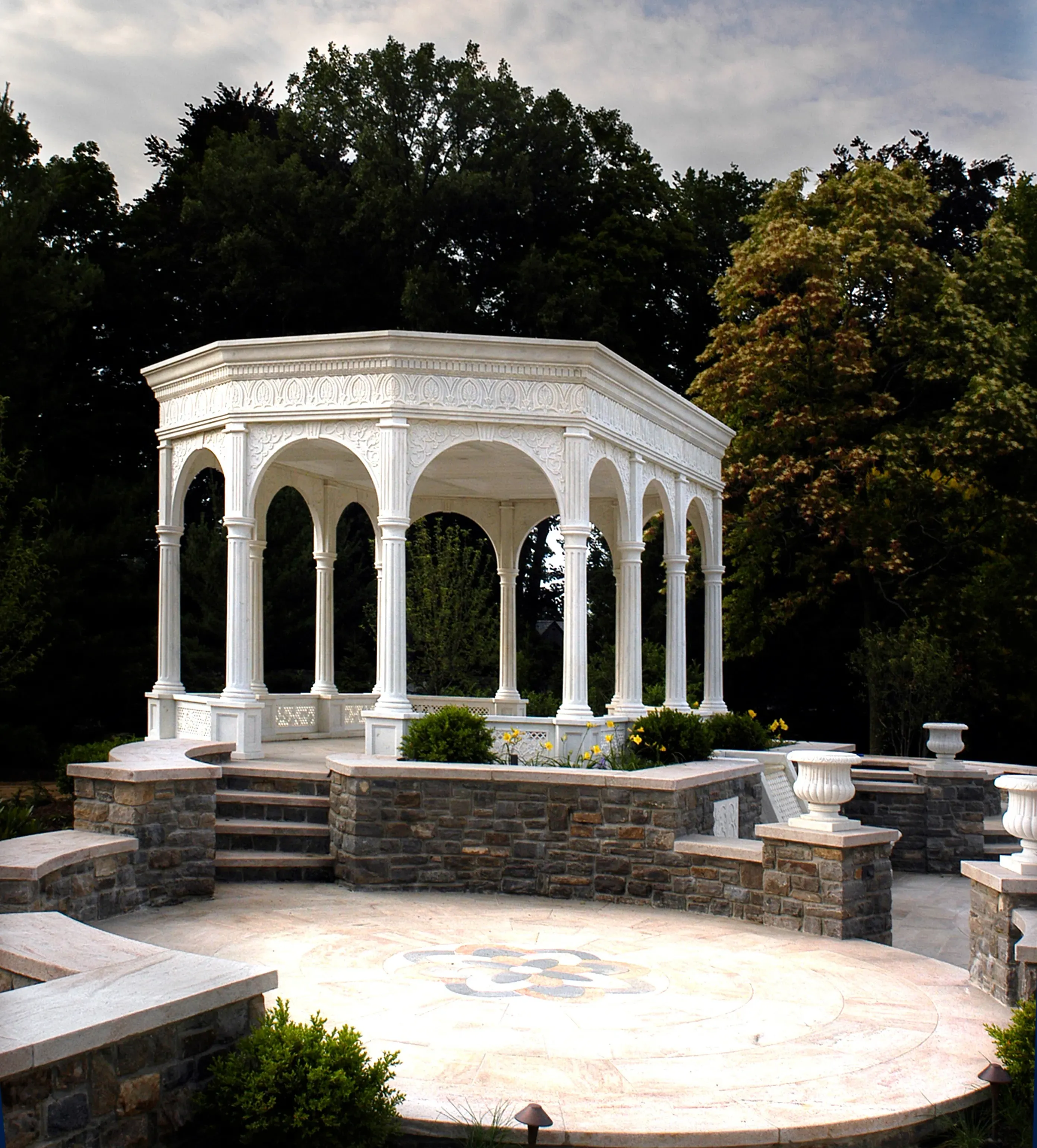 White marble pavilion with arched columns on a raised stone terrace with an inlaid marble floor, Westport, Connecticut
