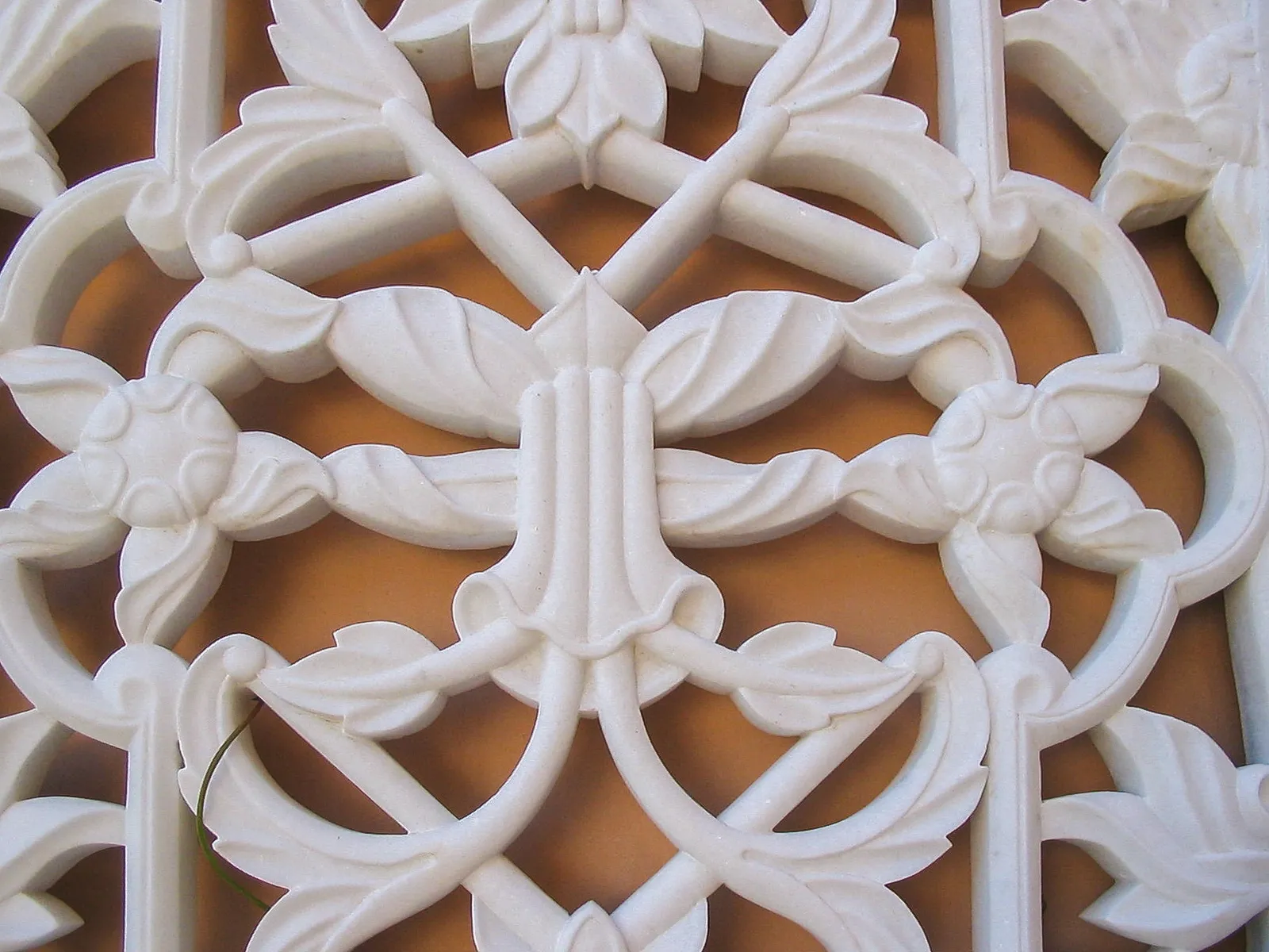 Detail of floral vine openwork hand-carved into a white marble jali screen, The Los Altos Hills Estate, California