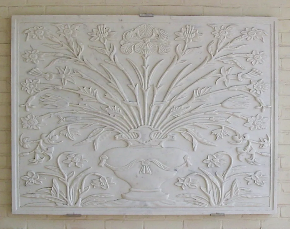 Hand-carved white marble relief panel of a vase with flowing floral stems, Westport, Connecticut estate