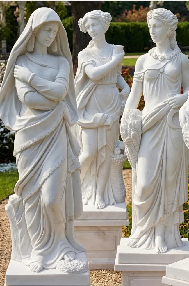 Close view of hand-carved white marble maiden statues on plinths in the garden, The Greenwich Estate