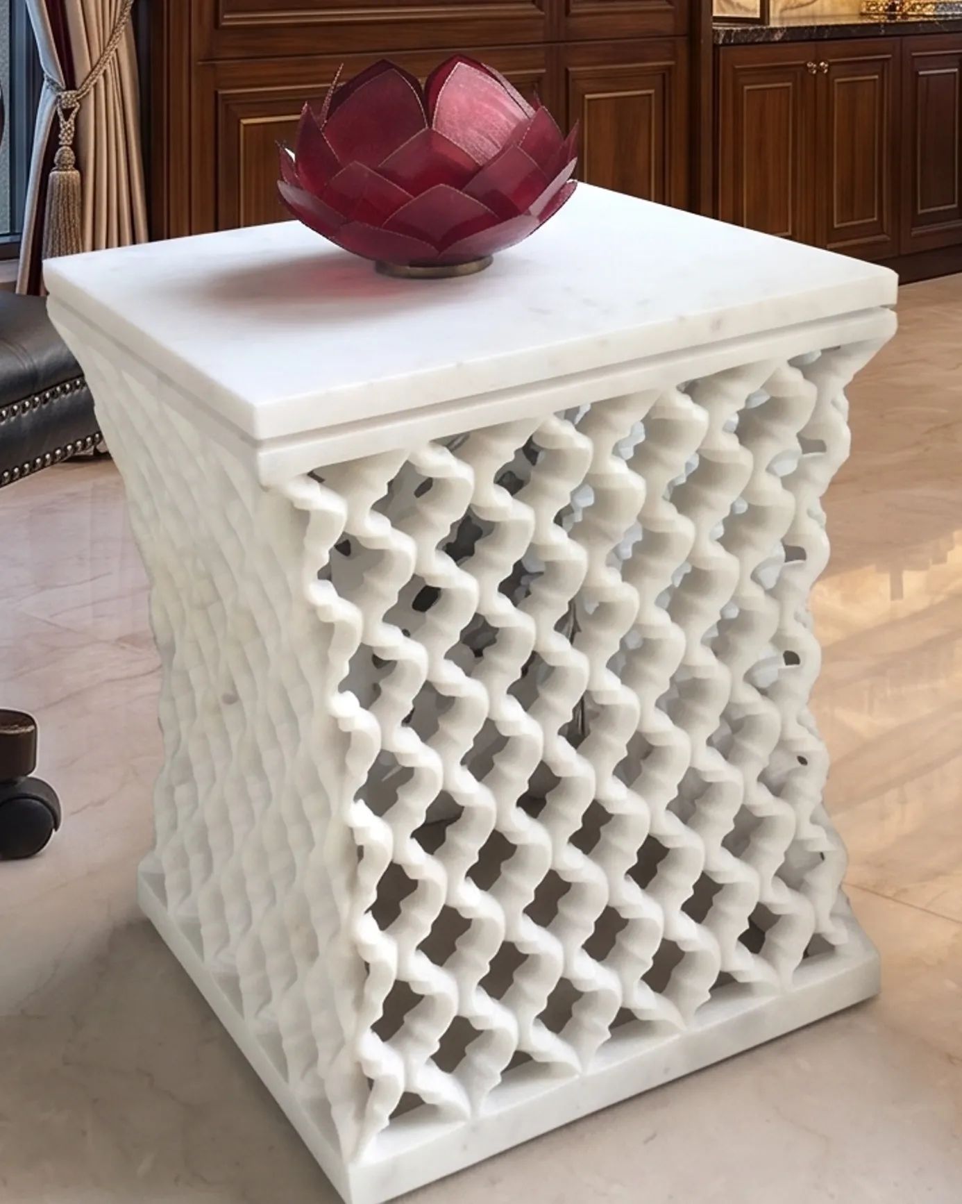 Hourglass-shaped white marble jali side table with a ruby glass bowl, private residence, New Delhi