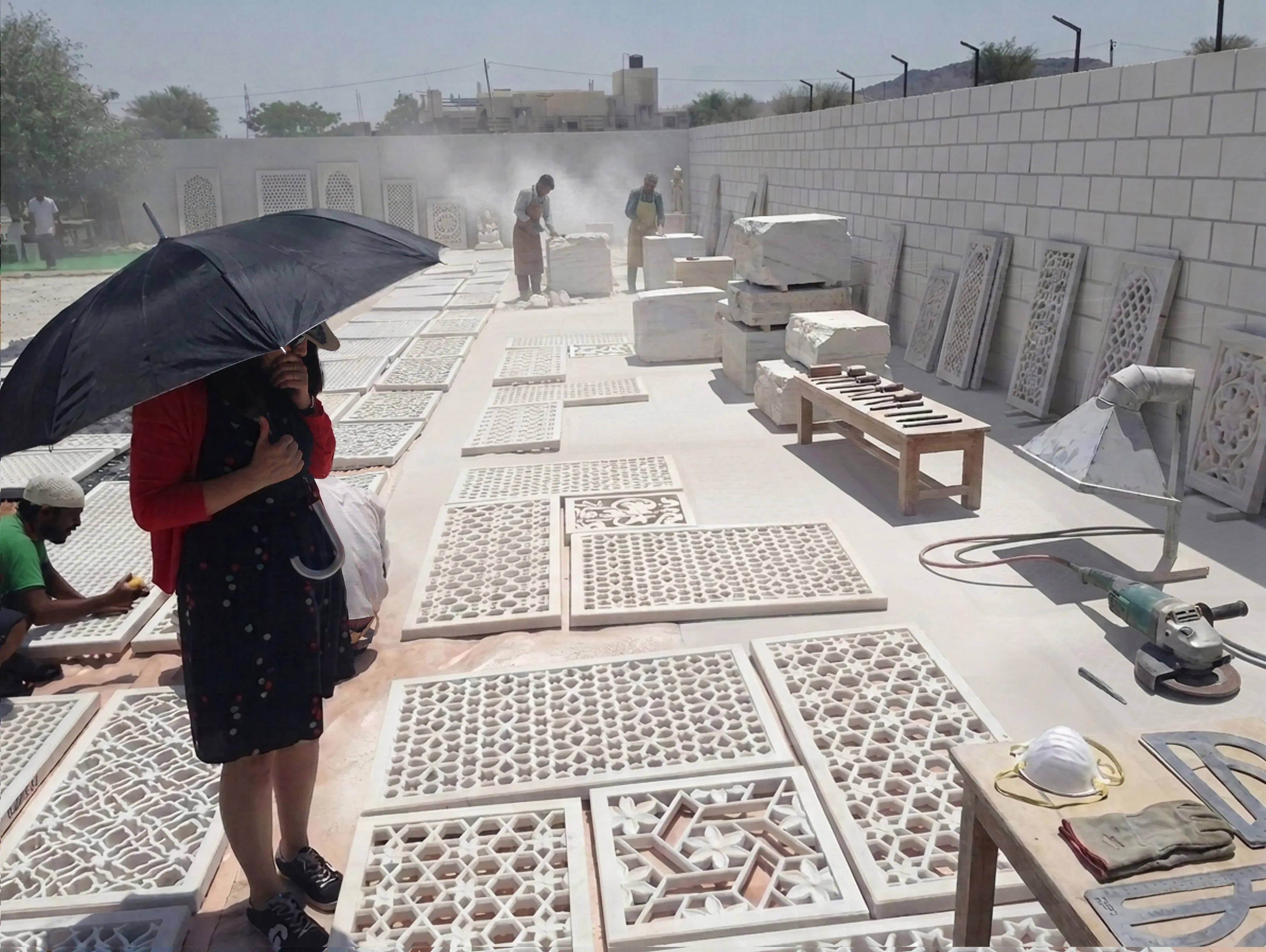 Carved jali panels laid out on site for inspection before installation at the Elite Residence, Kuwait