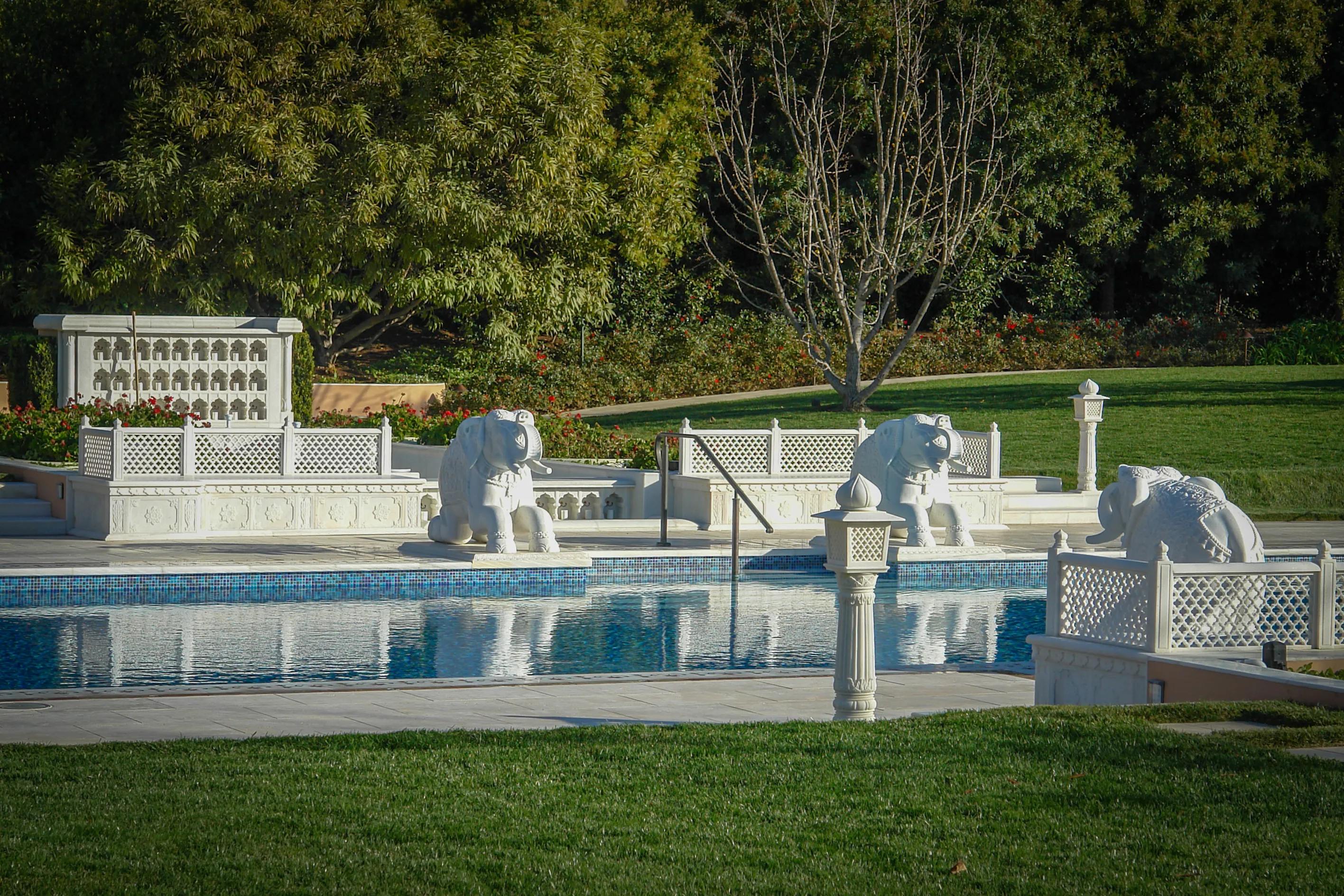 White marble elephant sculptures and lighting columns along the pool terrace, The Los Altos Hills Estate