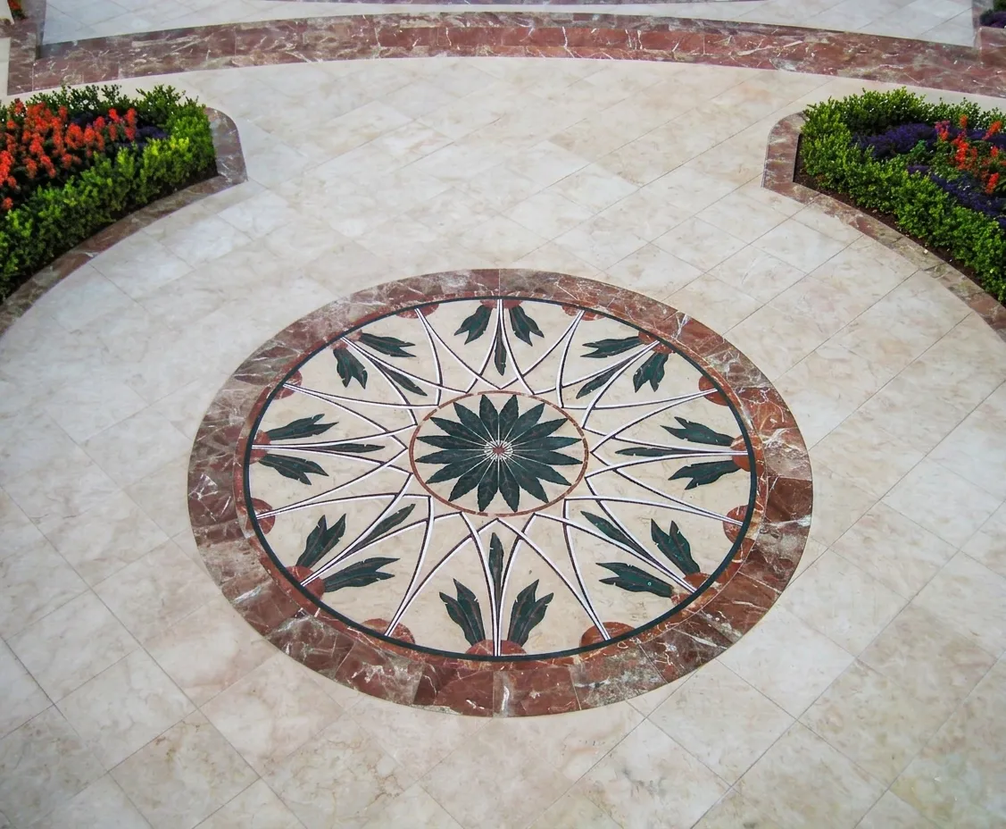 Concentric stone inlay floor medallion with a star motif in the garden paving, The Los Altos Hills Estate