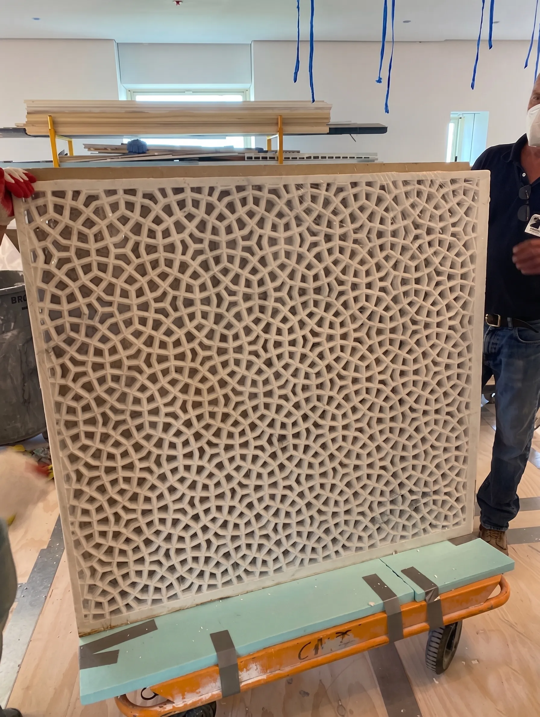 Marble jali panel strapped to a trolley during delivery into The Plaza Residence