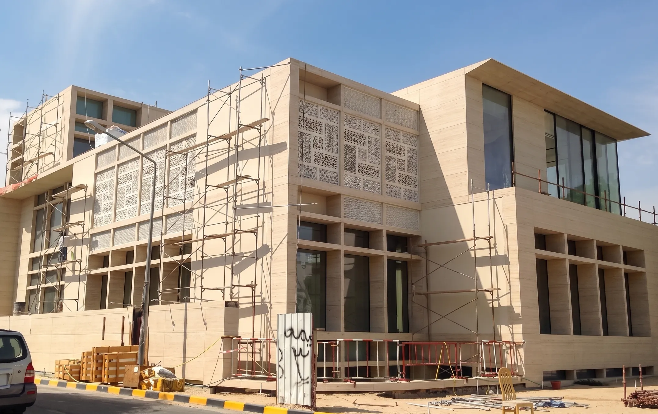 Elite Residence, Kuwait, under construction with jali facade panels and scaffolding in place