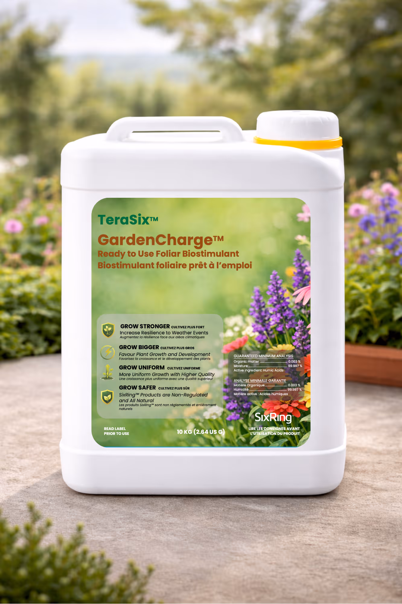 White container of TeraSix GardenCharge foliar biostimulant with garden flowers in background.