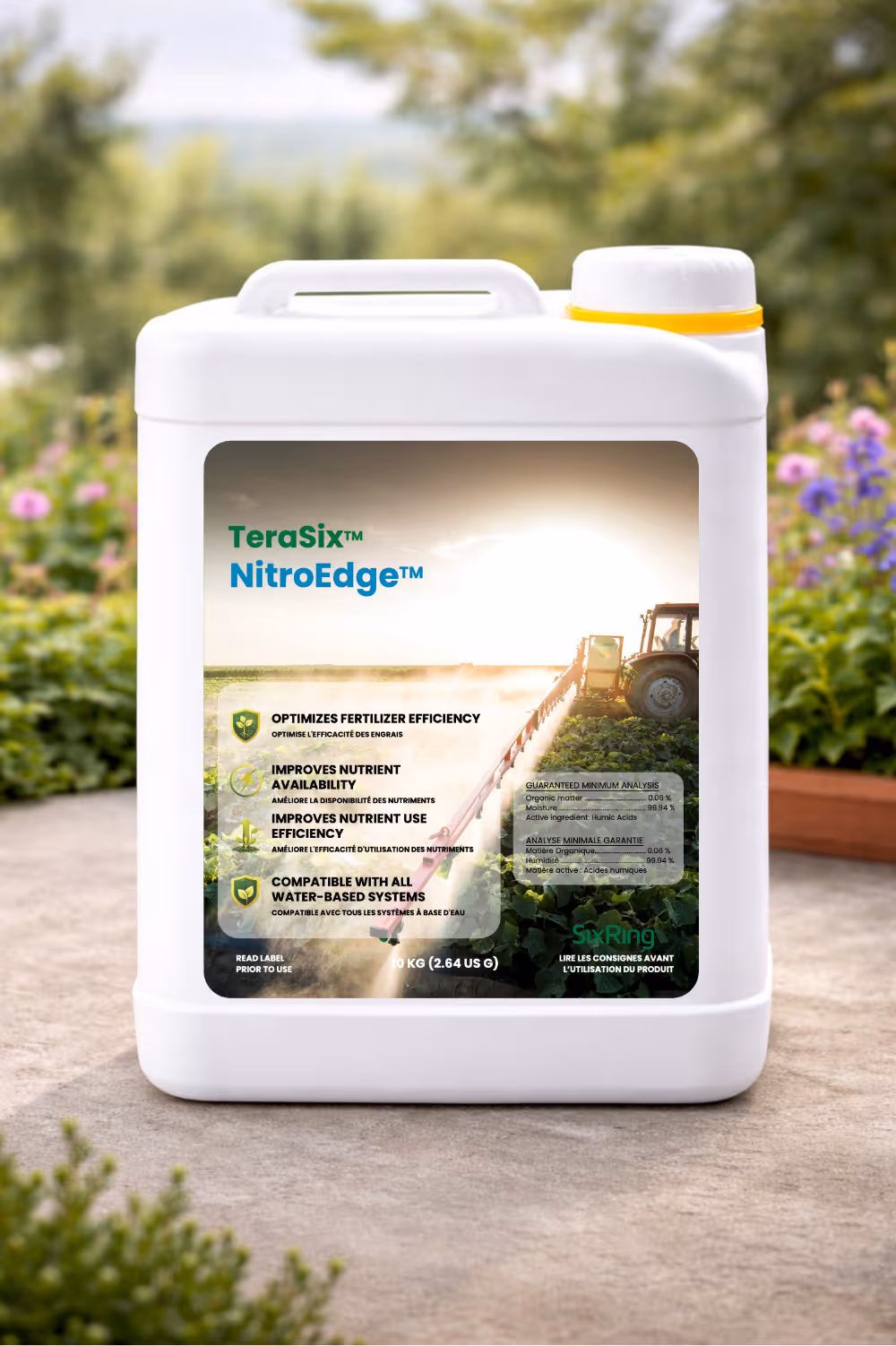 White container of TeraSix GardenCharge foliar biostimulant with garden flowers in background.