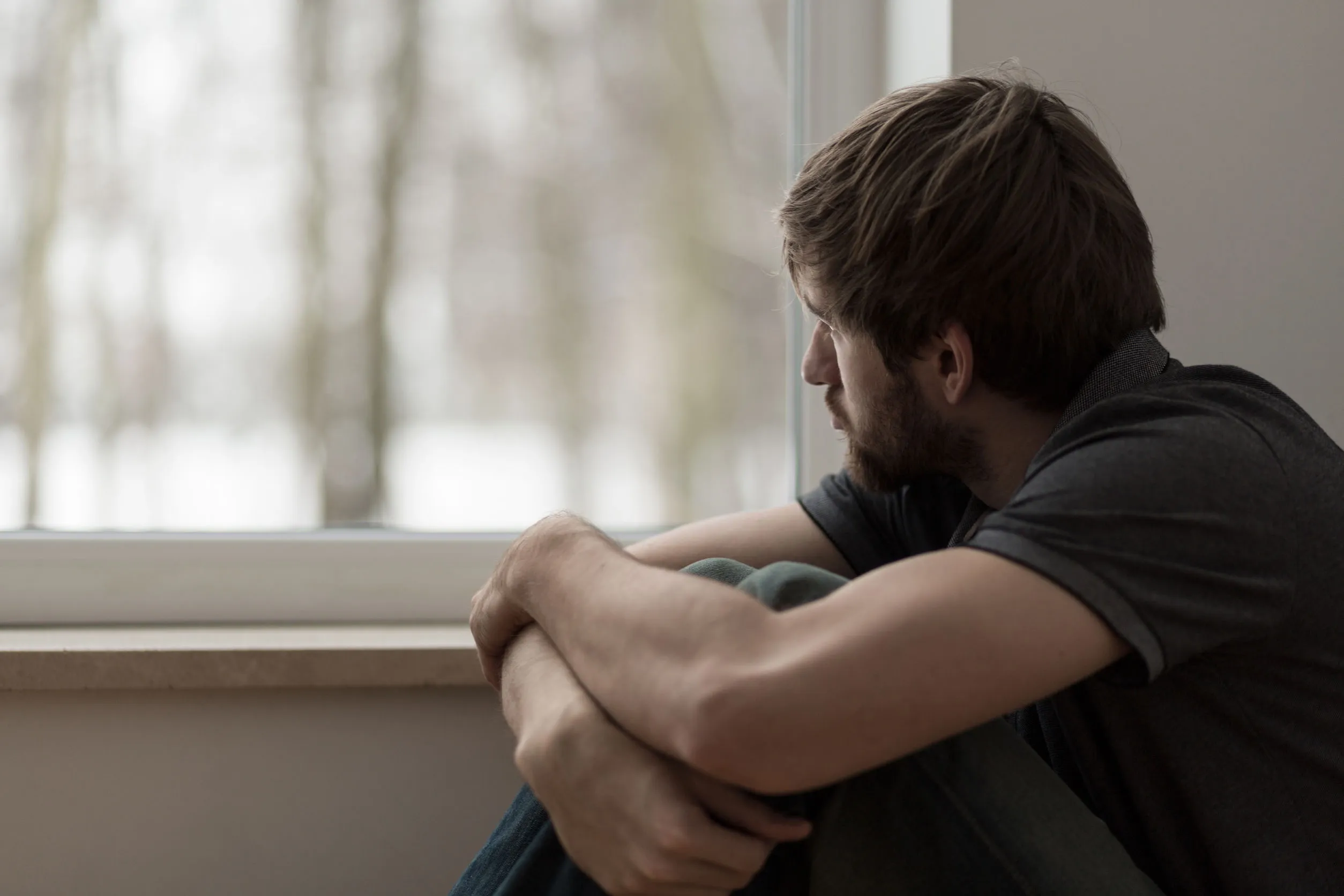 Portrait of young man suffering for depression