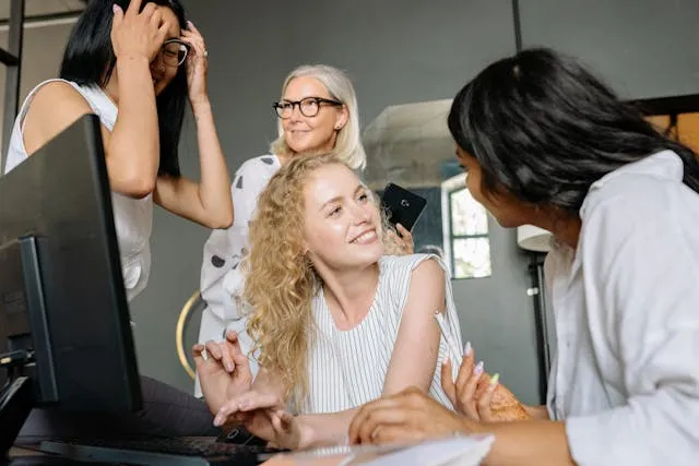 group of coworkers discussing something and listening