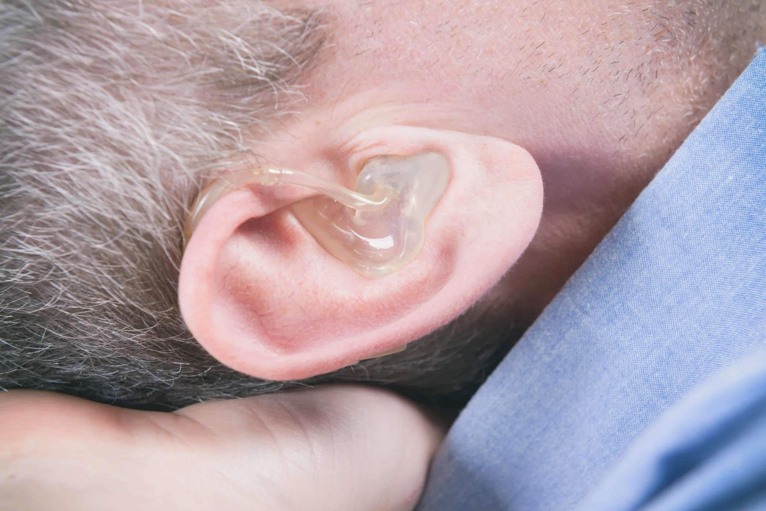 man wearing a stuttering treatment device