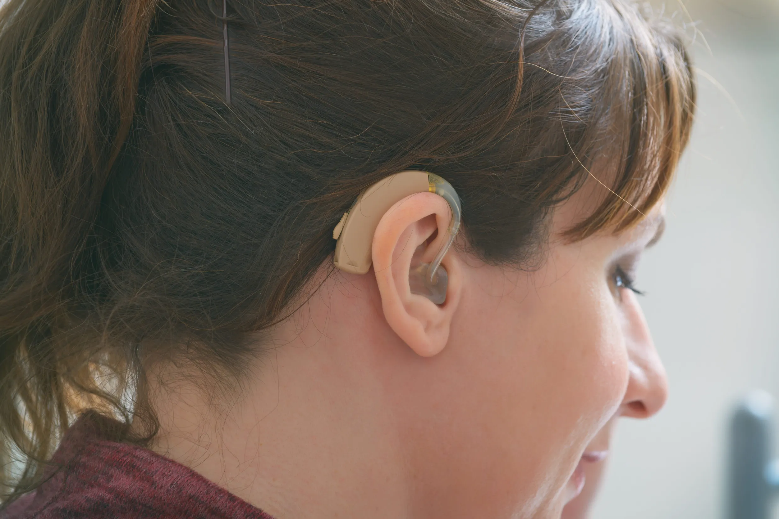 woman wearing a discreet speech device