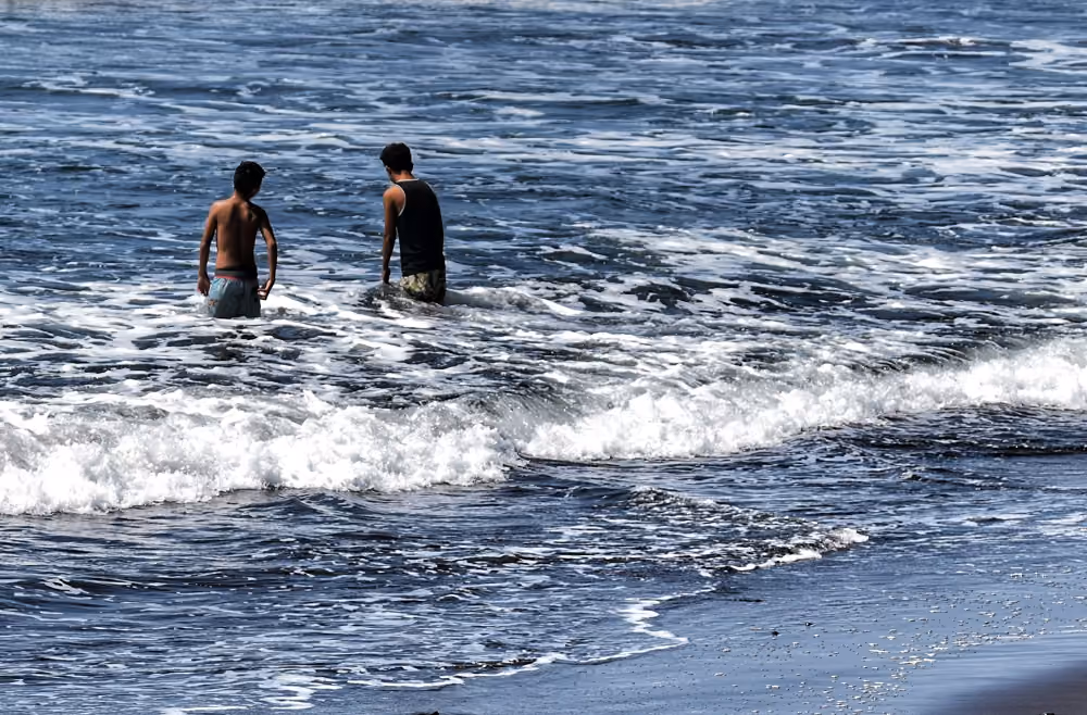 kids playing in ocean