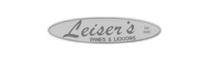Oval sign with 'Leiser's Wines & Liquors' in stylized black text on a gray background.