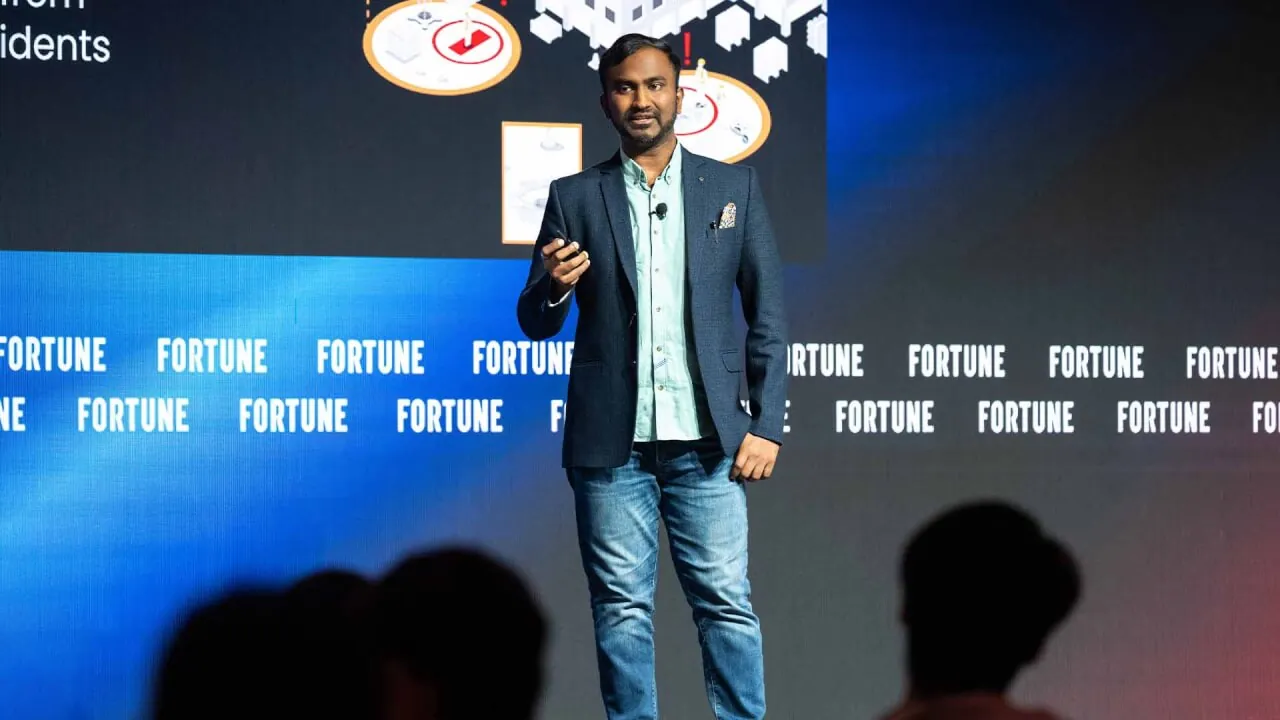 Vishnu Saran presenting on stage at Fortune Brainstorm AI Singapore 2024
