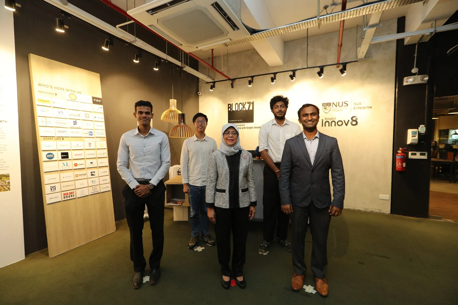 President Halimah Yacob with the Invigilo team at BLOCK71