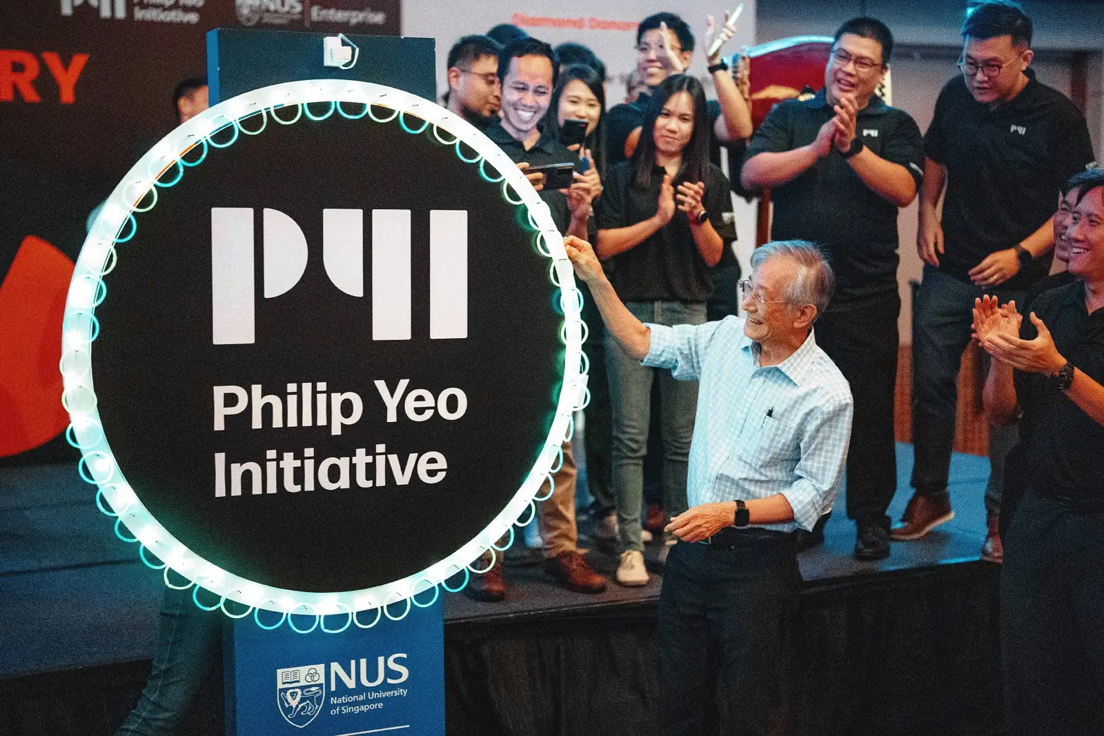 Philip Yeo unveiling the Philip Yeo Initiative logo at the programme's 10th anniversary