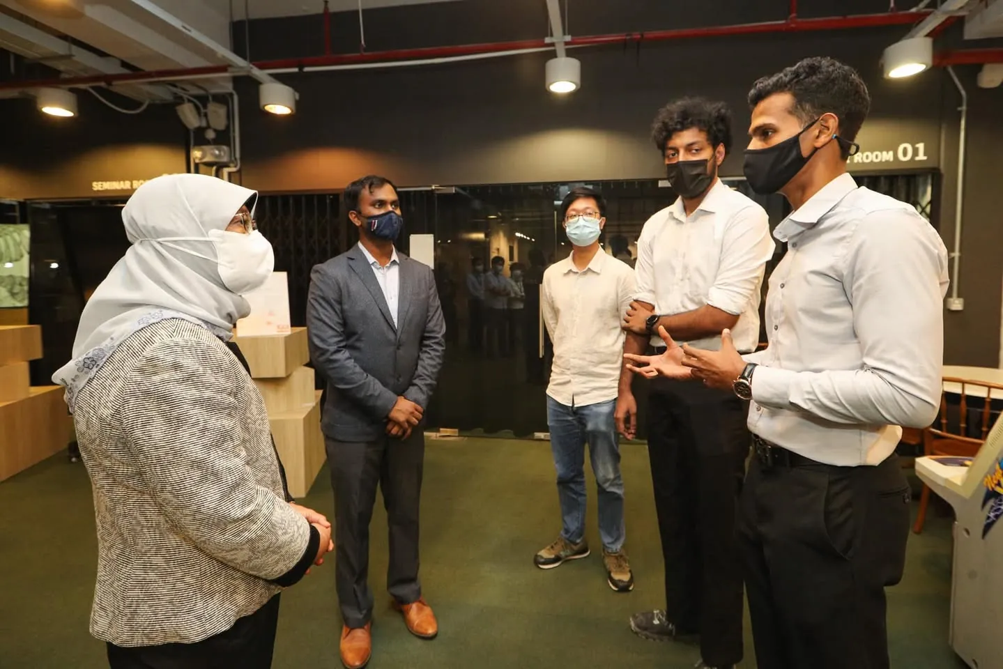 President Halimah Yacob speaking with the Invigilo team during the June 2022 visit