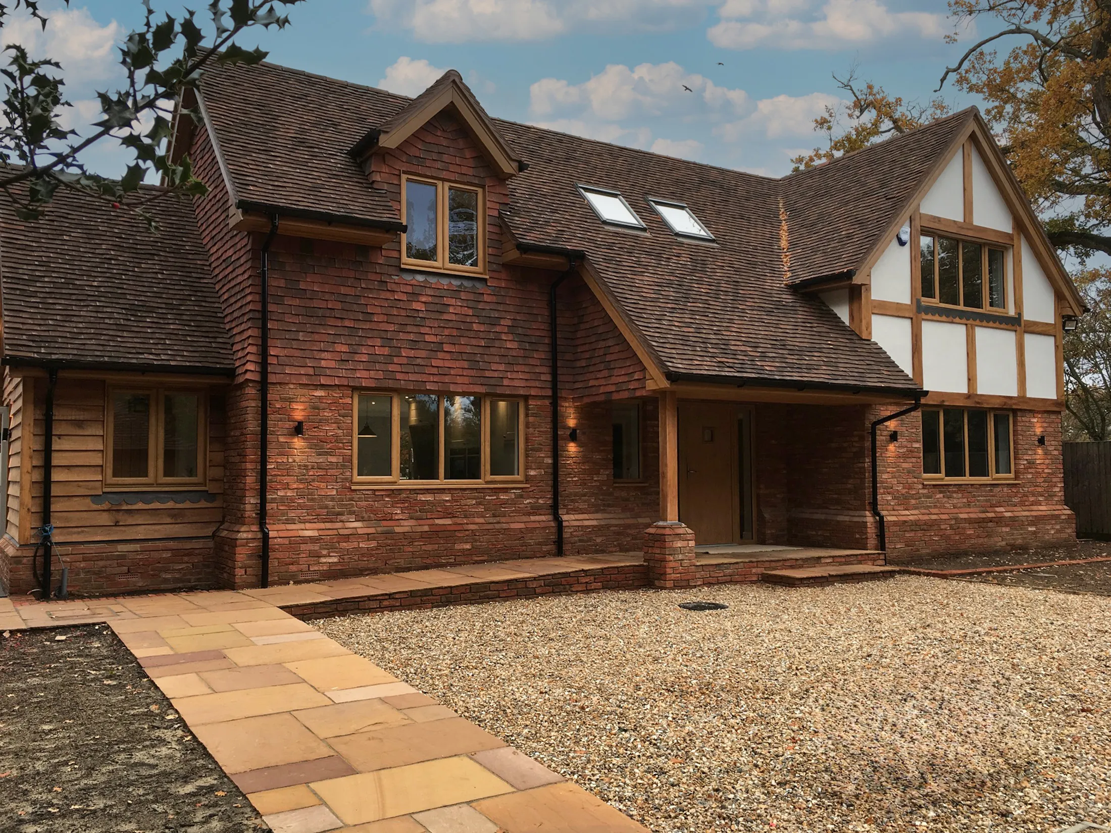 A large country home with timber beams and nice lighting at dusk in autumn