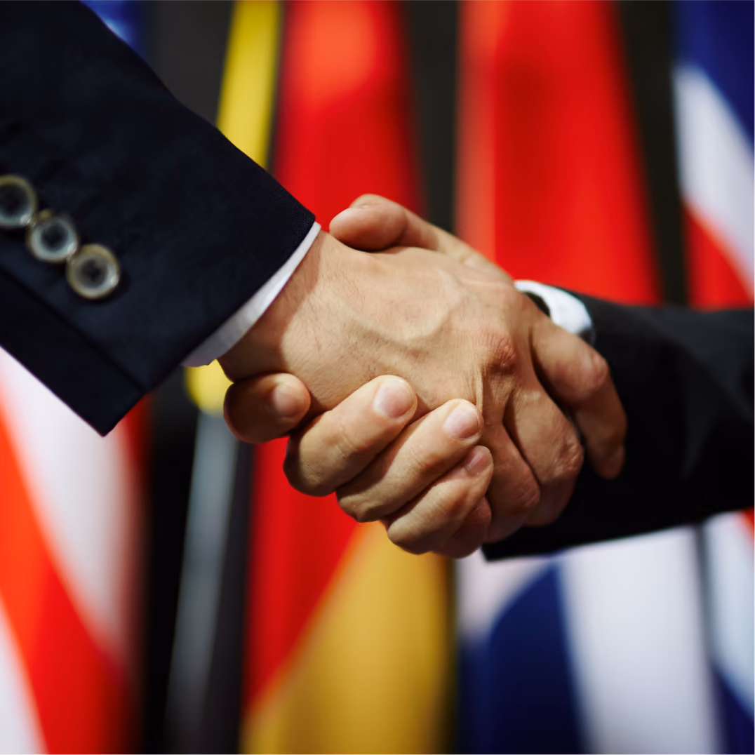 Professional diplomatic handshake symbolizing embassy affairs, international cooperation, foreign relations an