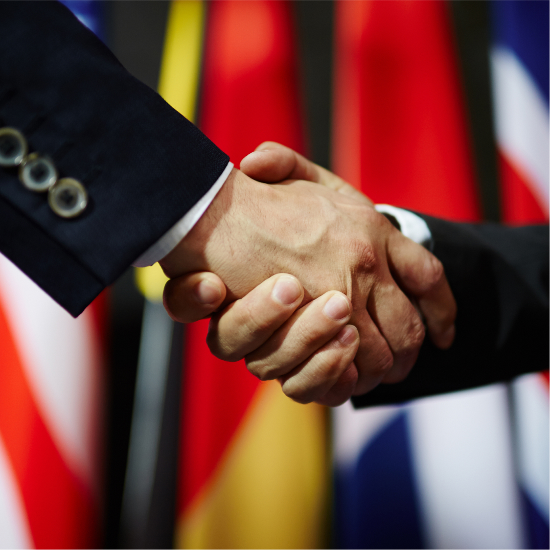 Professional diplomatic handshake symbolizing embassy affairs, international cooperation, foreign relations an