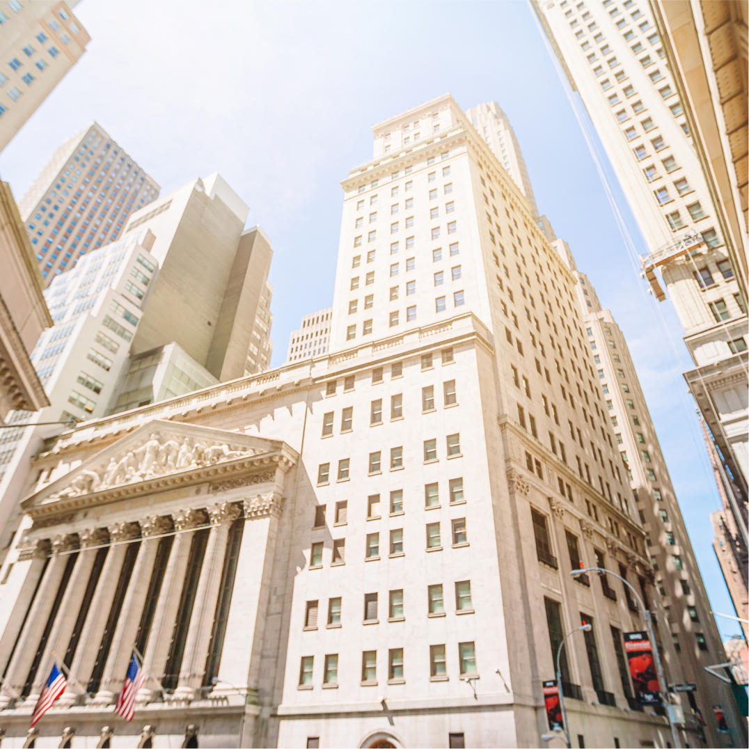 Wall Street exchange building facade, representing financial services and insurance institution clients today.