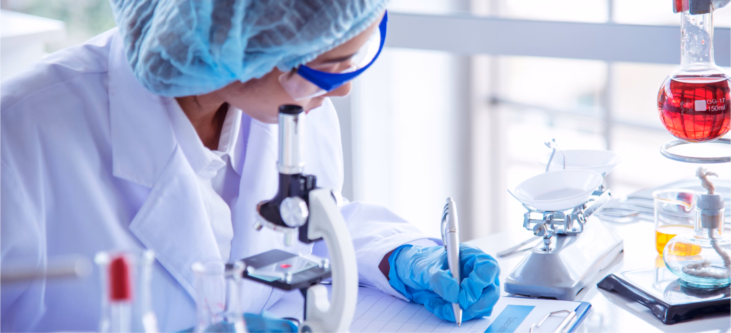 Lab scientist examining a sample, representing pharmaceutical research and drug development pipeline deck now.