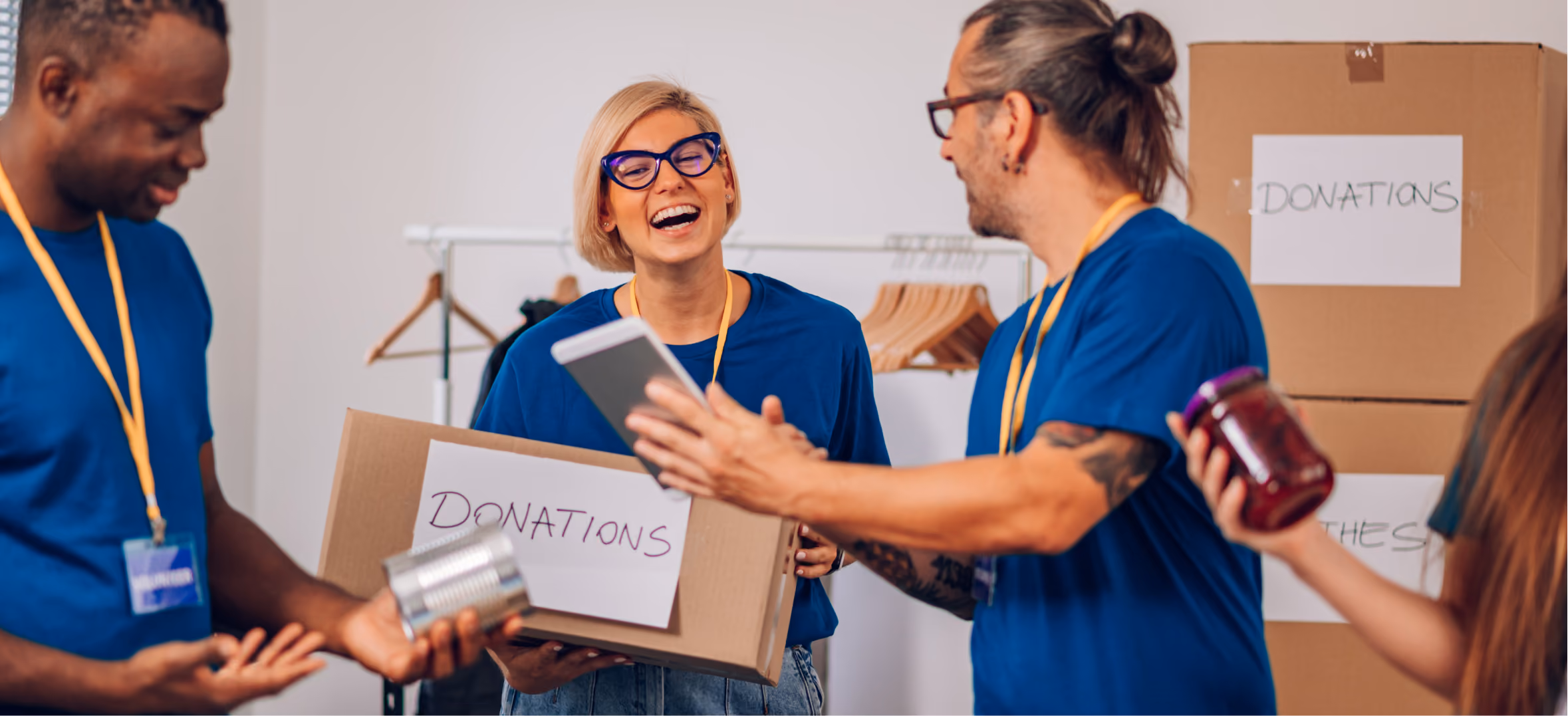  Volunteers packing donation boxes, representing nonprofit social impact and CDFI presentation design work now.
