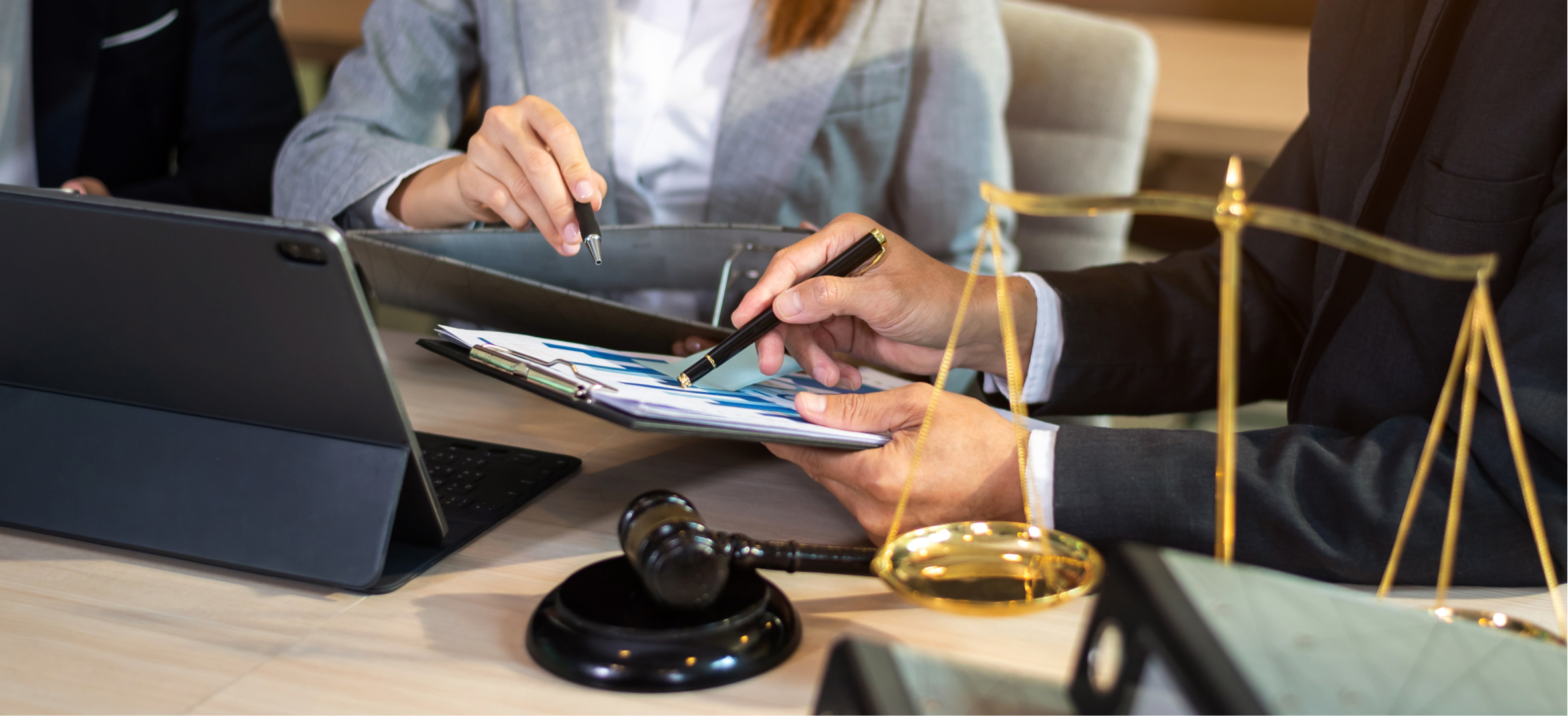 Attorneys with gavel and scales of justice, representing law and professional services firm presentation work.
