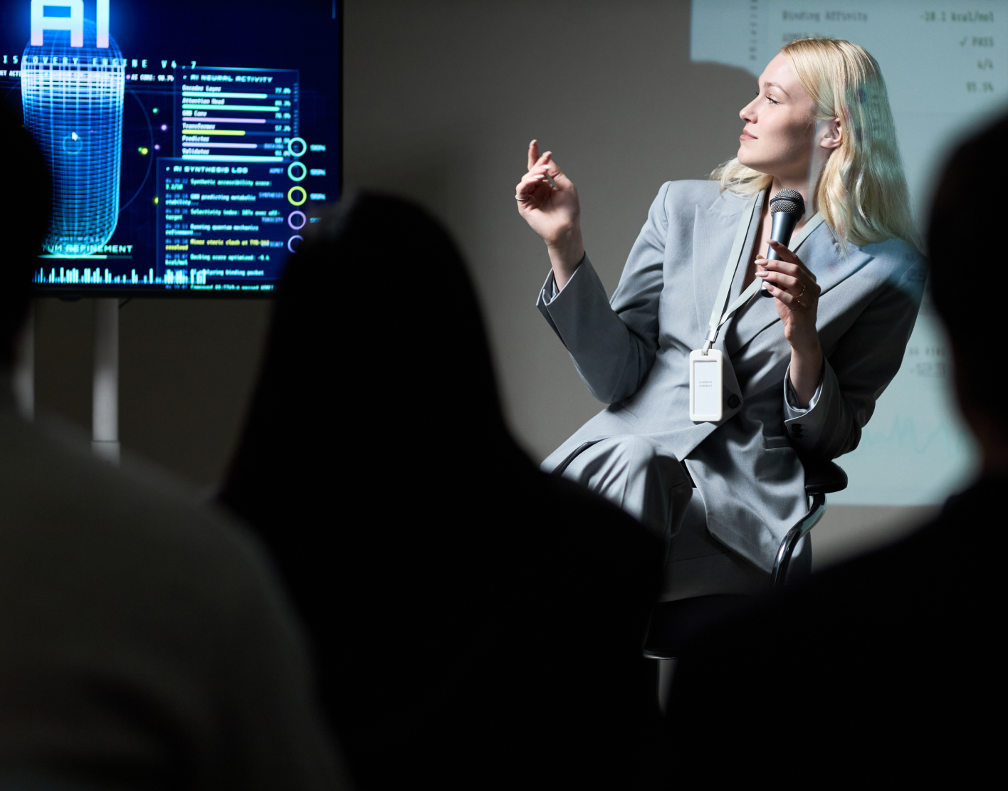Speaker delivering AI cybersecurity presentation to executive audience with clear visual insights and strategy