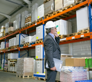 Logistics professional reviewing warehouse operations for a supply chain presentation designed for Singapore b
