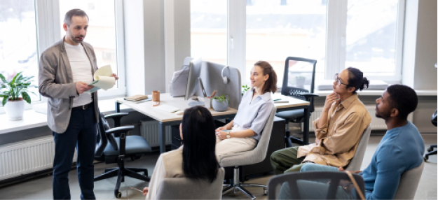Presentation consulting team collaborating on business slides, messaging, visual design, and audience-focused
