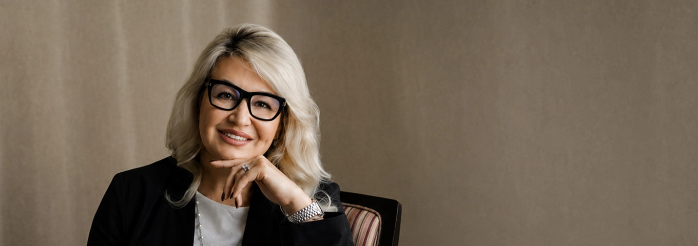 Portrait of Anna Tokaeva, Managing Director and Global Head of Client Coverage at Roemer Capital, in a modern office environment.