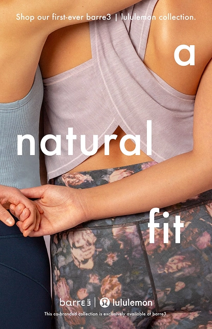 Close-up of two women standing side by side wearing barre3 and Lululemon activewear, one in a blue sports bra and black leggings, the other in a lavender crop top and floral patterned leggings, with text promoting the first-ever barre3 | lululemon collection and the tagline 'a natural fit.'