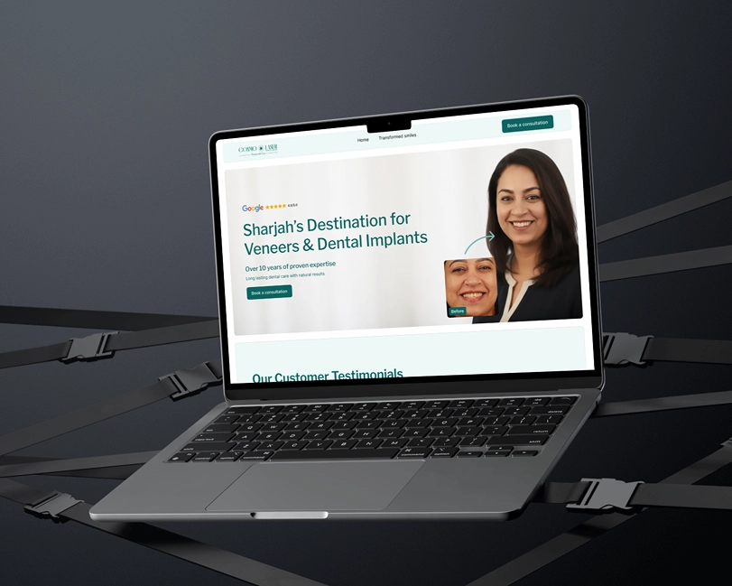 Laptop displaying a dental clinic webpage featuring a smiling woman and a smaller before photo, with text promoting Sharjah as a destination for veneers and dental implants and a button to book a consultation.