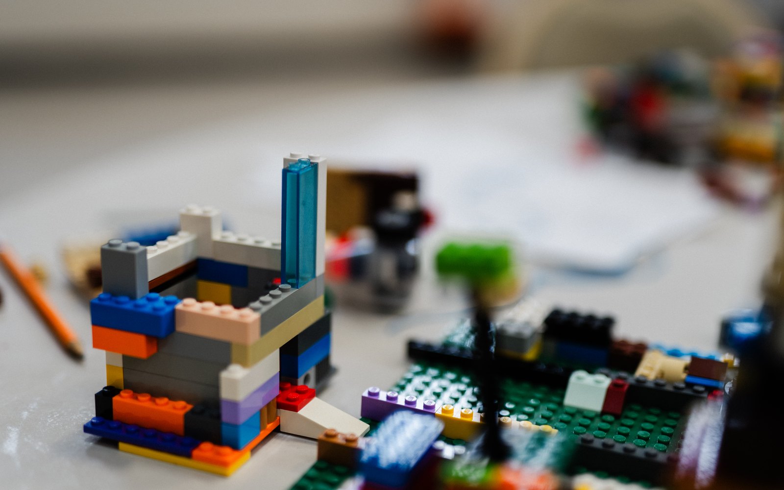 A LEGO build in progress on a table at a Journey to STEAM program