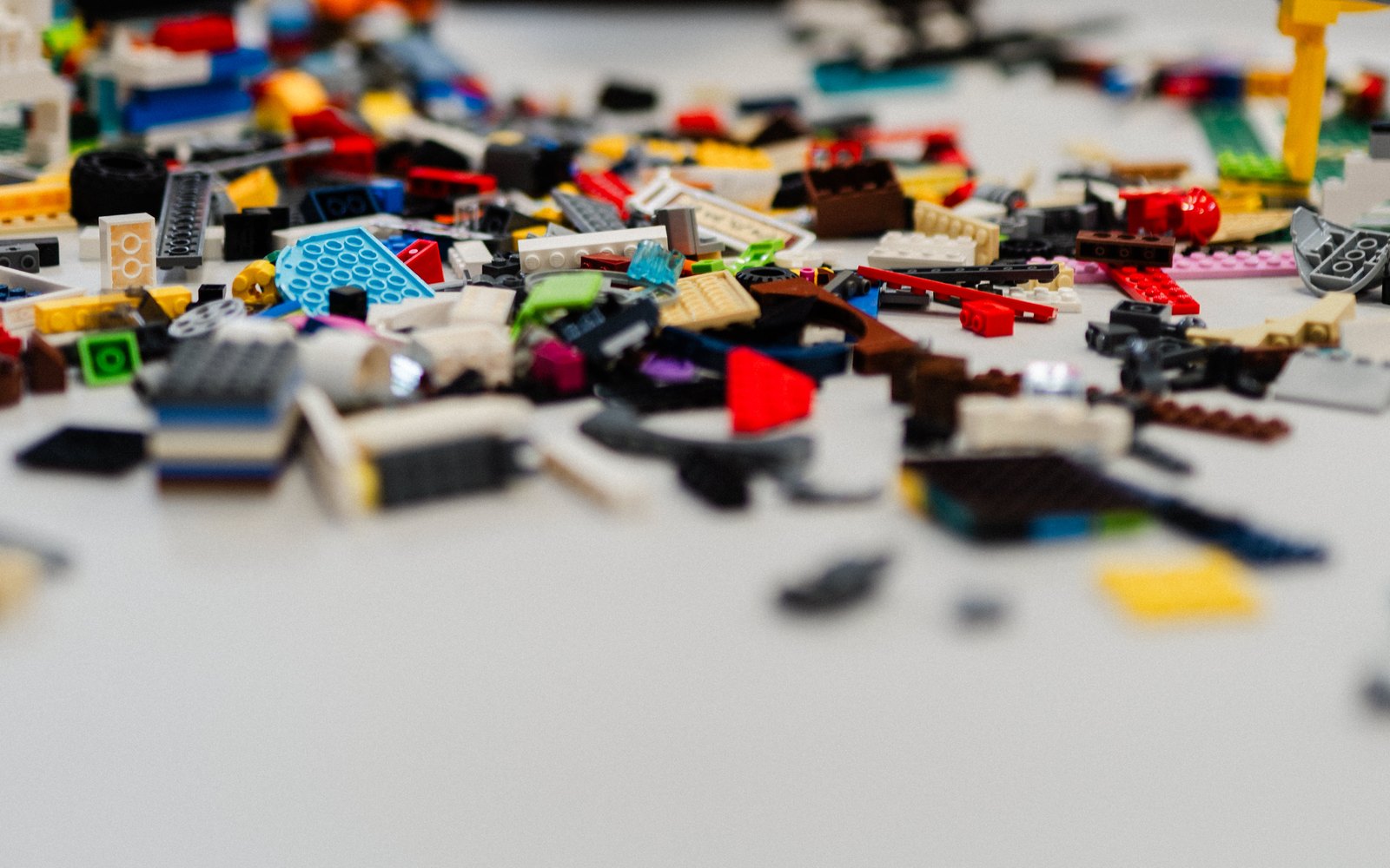 LEGO pieces and part-built models spread across a table at a Journey to STEAM session