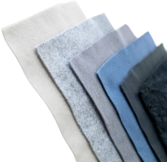 Stack of rectangular felt fabric pieces in white, grey, blue, and black laid overlapping.