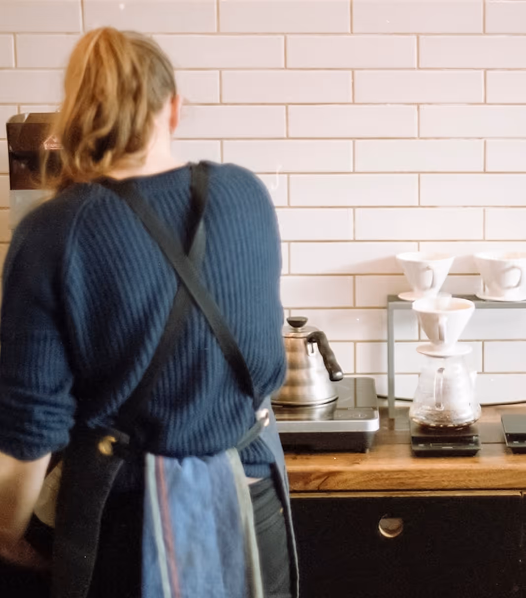 An image of a barista working behind the counter, from Death to Stock by Brett Danielson 