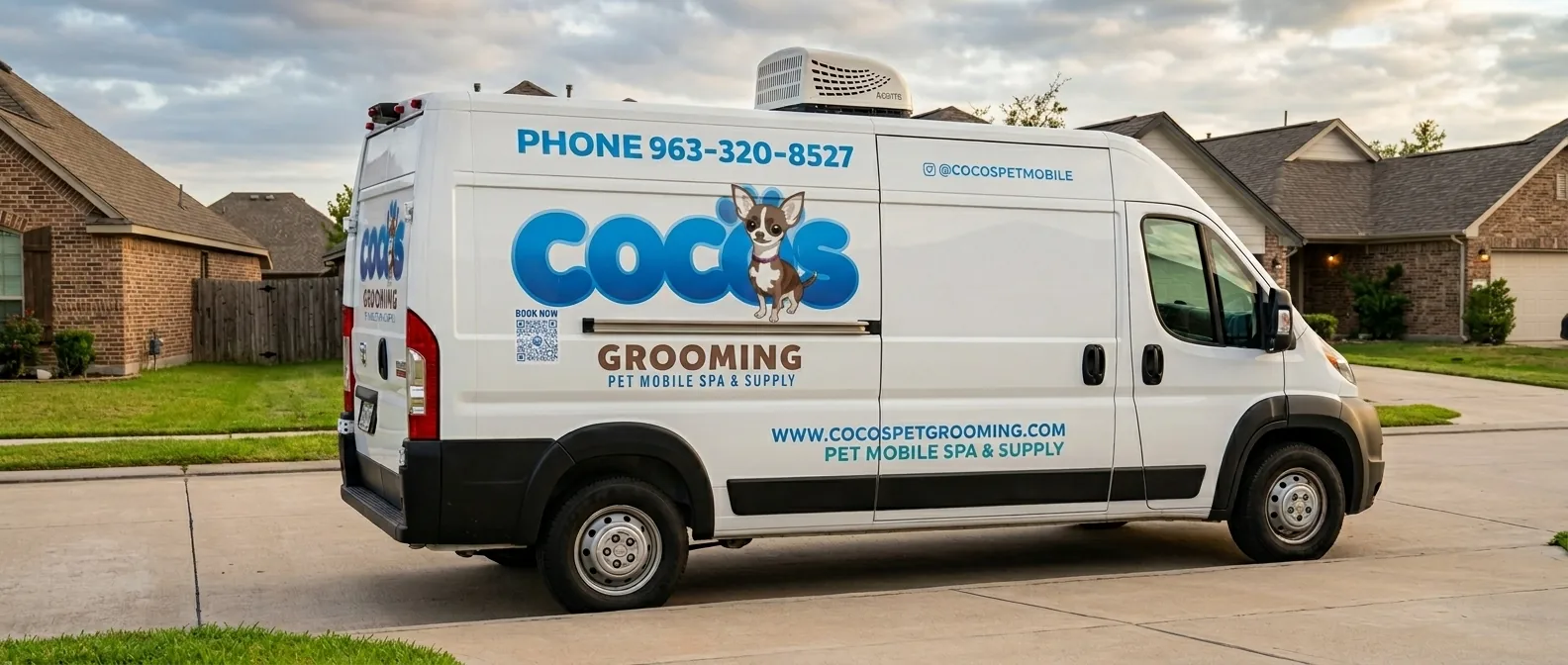 White mobile pet grooming van with Coco's logo, dog illustration, contact phone, and website parked in a suburban street.
